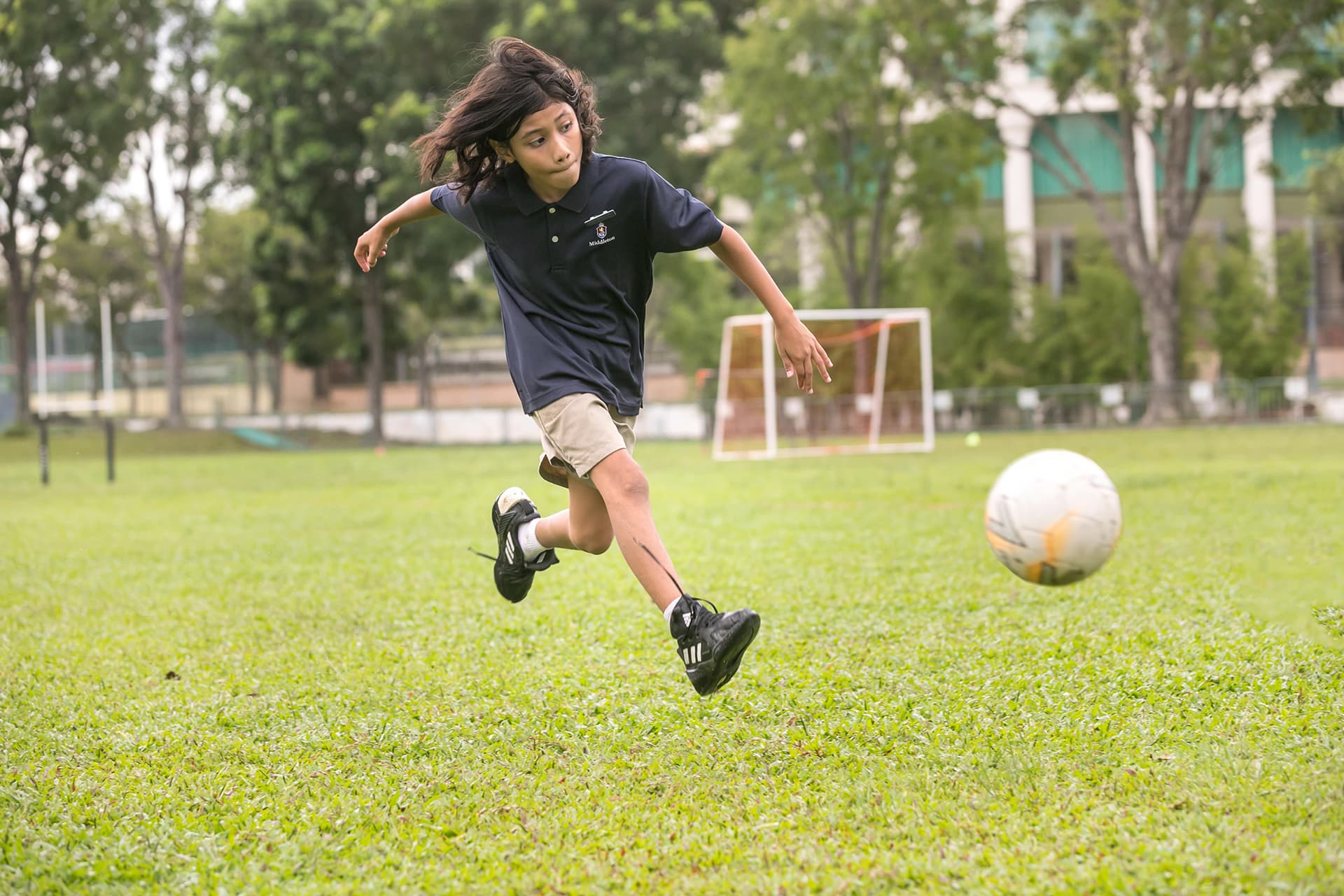 eca-2 Student kicking a ball